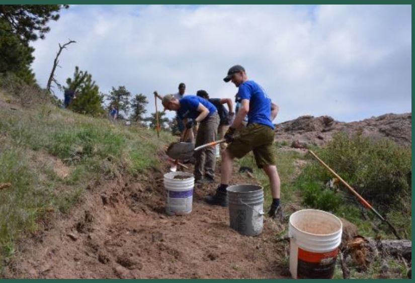 Volunteers doing trail maintenance. 