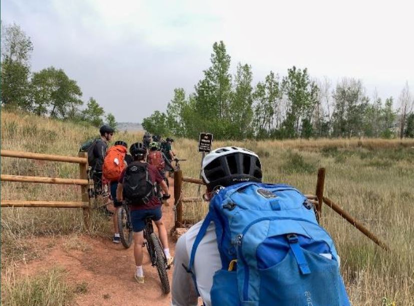 A group of mountain bikers heading out on the trail. 