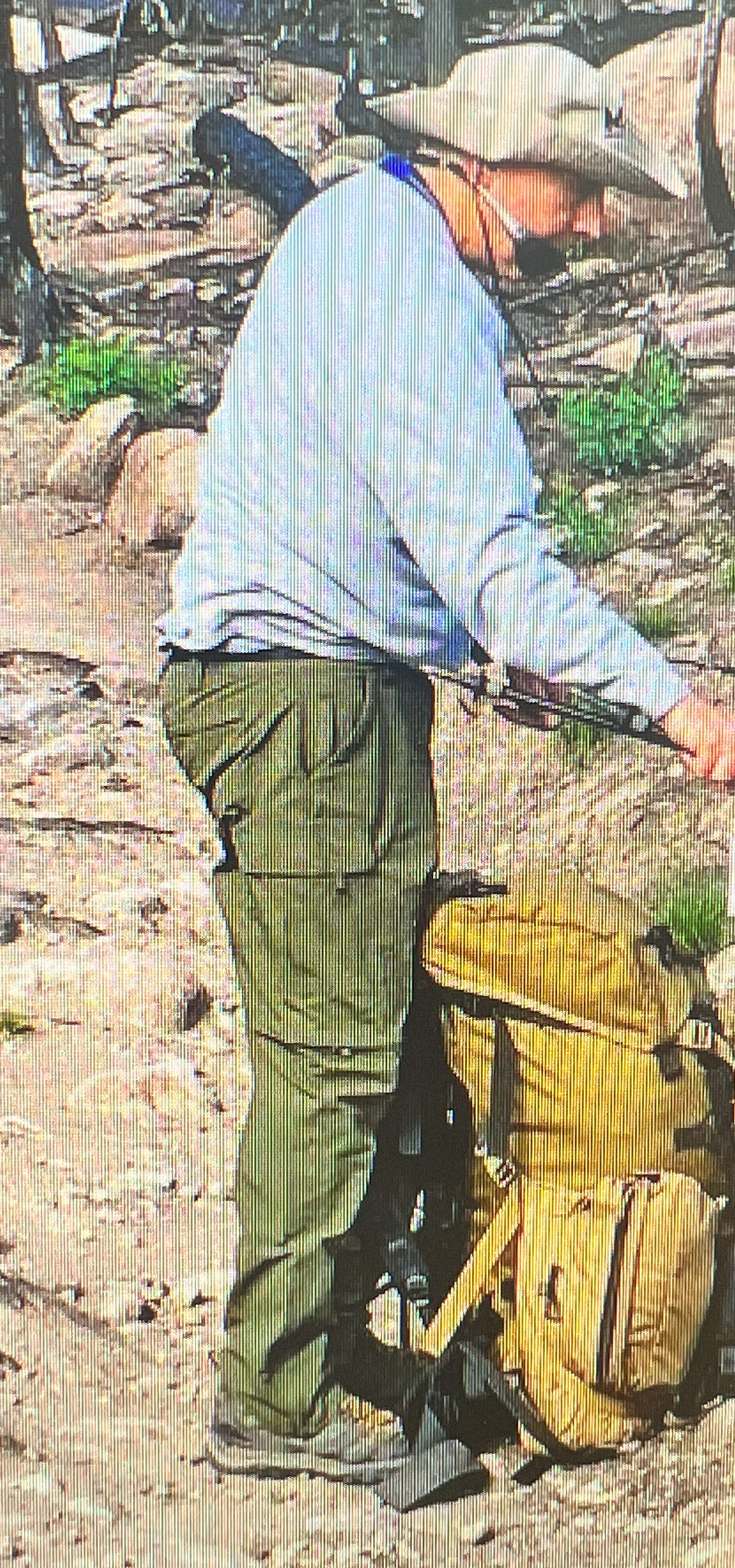 Image 2: side profile of a man in hiking gear