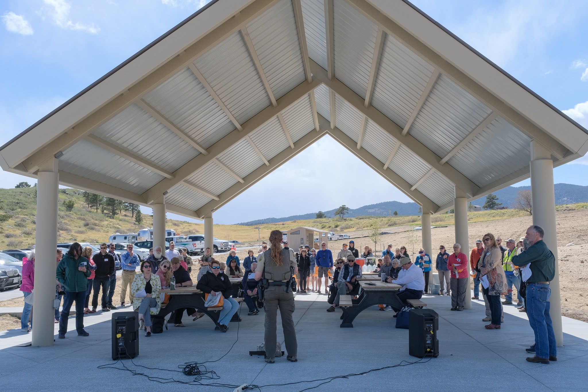 Image 1: Cindy Claggett, Carter Lake District Manager, addresses the crowd during the Sky View Campground ribbon cutting on May 12, 2022. (Rod Cerkoney)