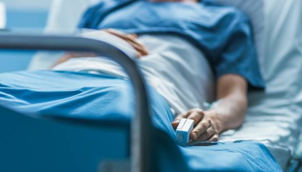 person in hospital bed
