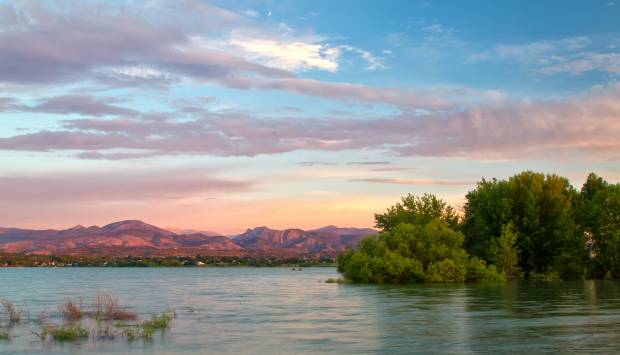 sunrise over a larimer county lake