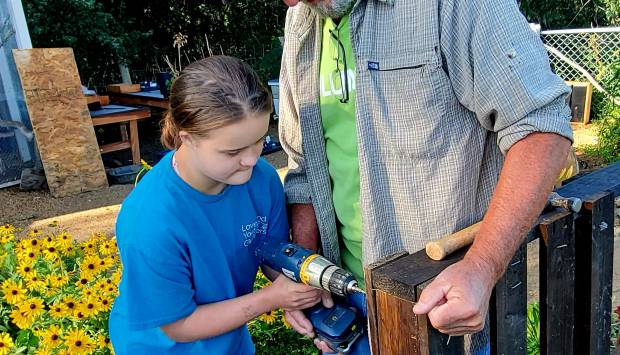 Loveland Youth Gardeners drilling solar demo project 