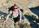 Christa climbing in the outdoors