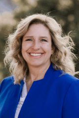 Larimer County Commissioner Jody Shadduck-McNally smiles for a photo
