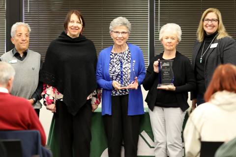 2023 award winners Ginger Haney and Phyllis McKeown stand with the Larimer County Commissioners