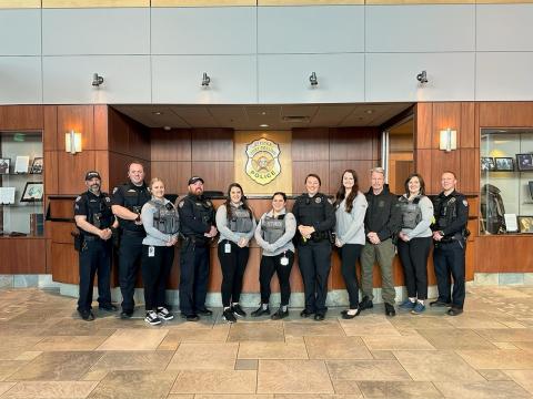Members of the Fort Collins Police Services Mental Health Response Team pose for a photo in the agency's lobby