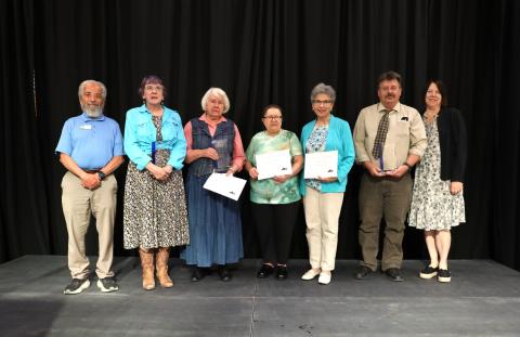Commissioner John Kefalas, awardees LoAnne Forschmiedt and Winnie Hanson, nominees Bojanka Crivilescu and Ginger Haney, nominator Steve Conaway, and Commissioner Kristin Stephens.