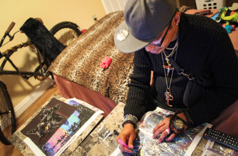 James "Crystal" Stearns works on diamond art in her bedroom at Primrose House in Loveland.