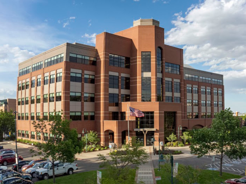 A photograph of the Larimer County Administrative Services Building located at 200 W Oak St in Fort Collins, Colorado