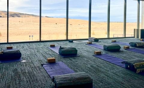 Several yoga mats are laid out on a floor at the Acute Care facility at Longview campus