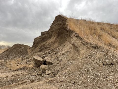 Mound of dirt covered in vegetation