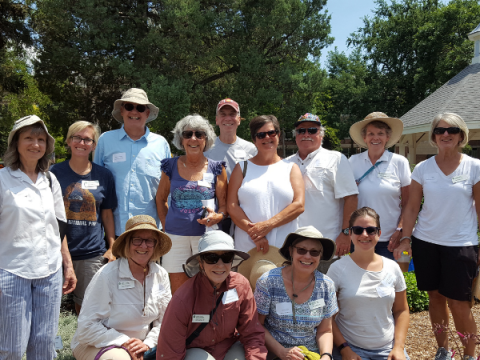 A group of Master Gardeners stand for a picture and smile.