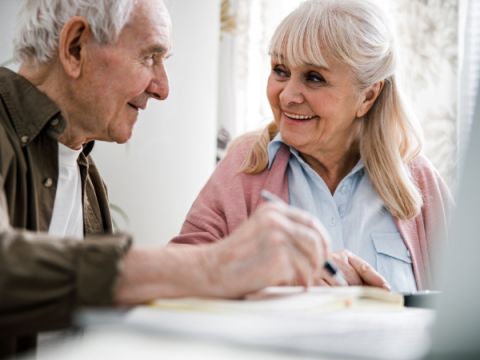 Advance Care Planning An older couple sits and discusses their plan.