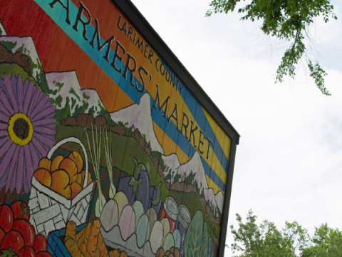 The colorfully painted Larimer County Farmers' Market Storage shed.