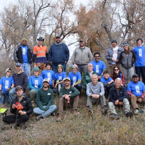Group of volunteers posing for photo after completing a volunteer project. 