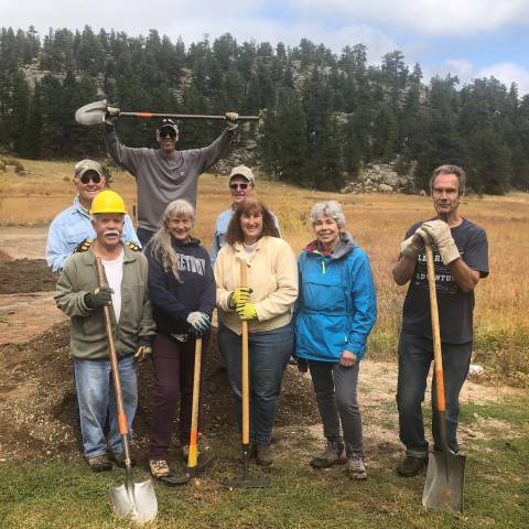 Group of volunteers posing for photo after completing a volunteer project. 