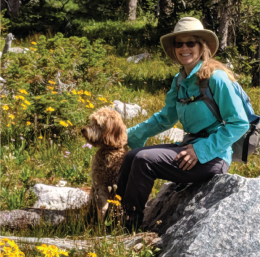 Photo of Marcee among native plants